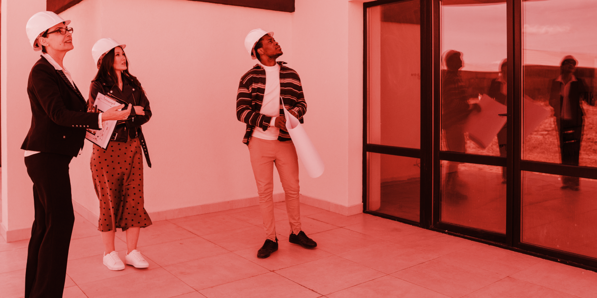 Property investors looking at a new build. Red branded overtone. 