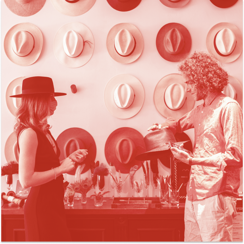 Shop assistant and customer in a Hat Retailer