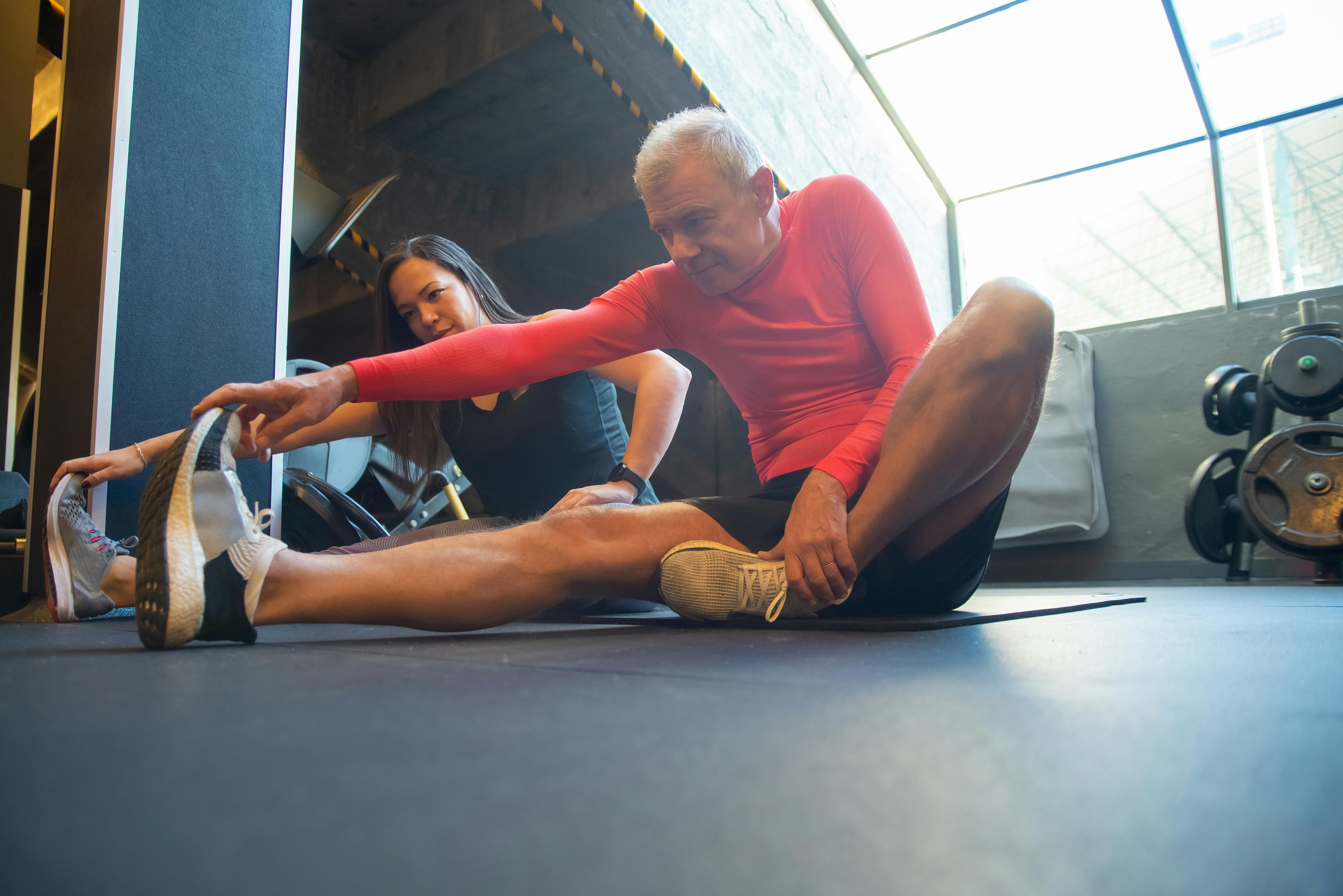 Older Man Stretching at Gym